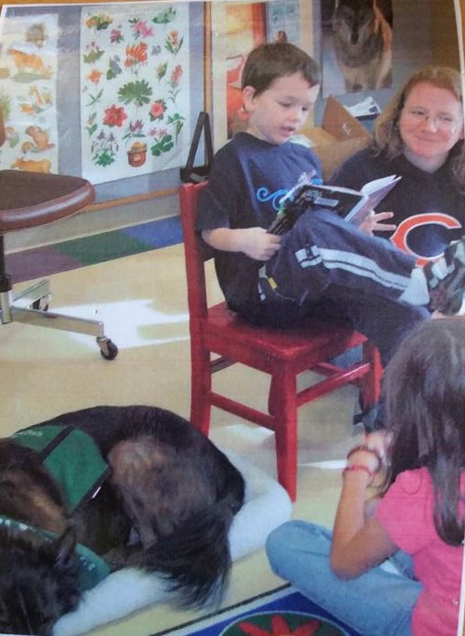 Reading to a therapy dog at the library