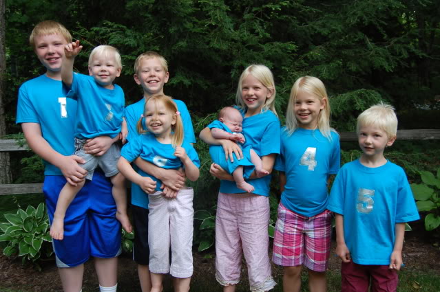 the 8 kids in blue number shirts